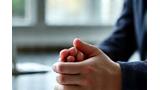 Thumbnail image of a person practicing deep breathing exercises in a calm office environment, promoting stress reduction